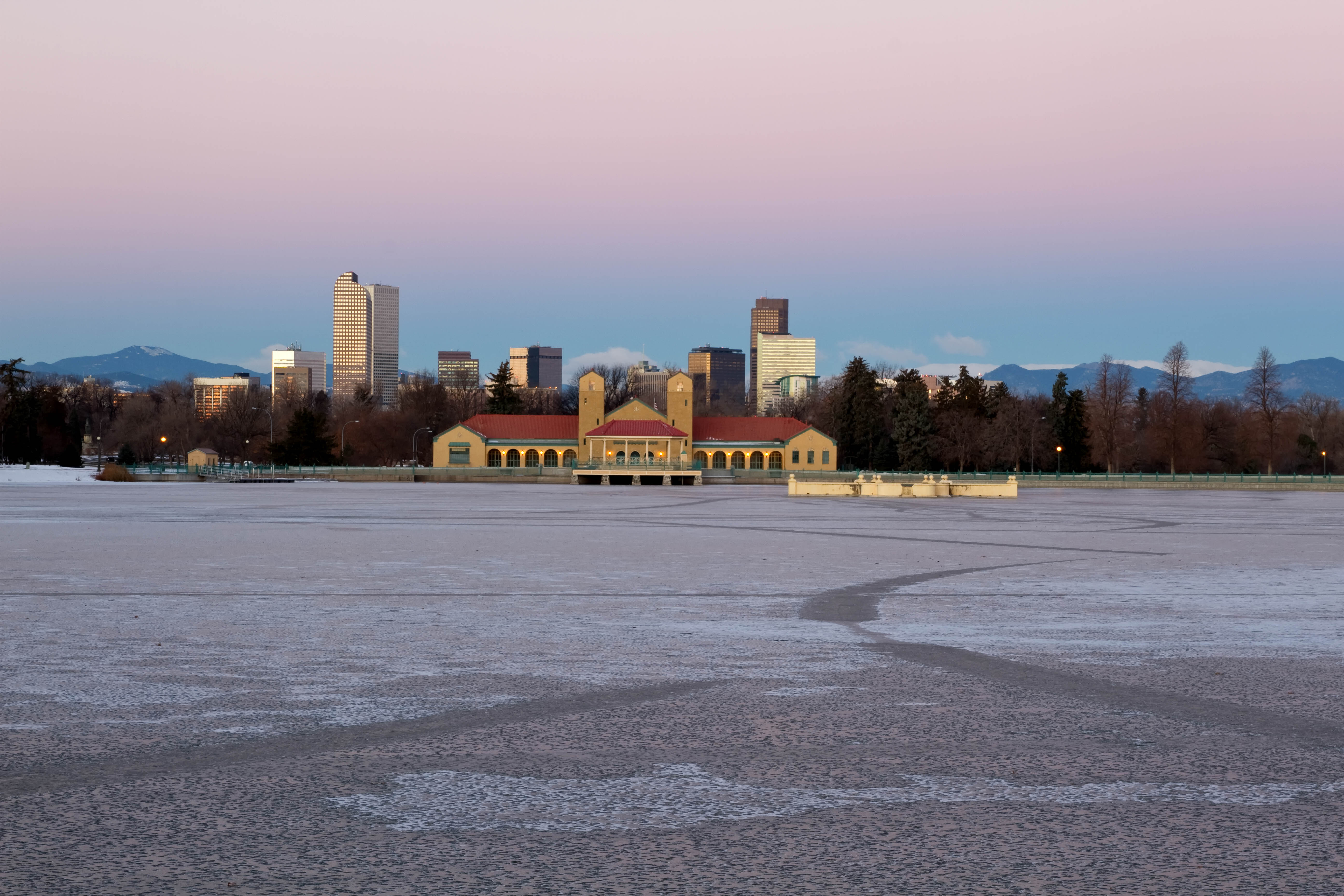 Eary morning sunrise on Denver City Park in the winter with a frozen lake