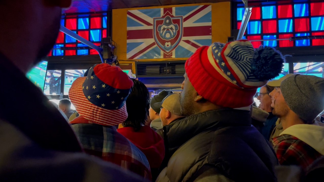 Close up of people standing in a bar