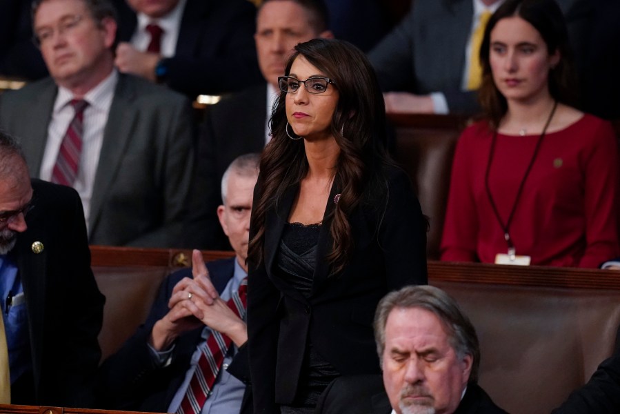 Rep. Lauren Boebert, R-Colo., votes present during the 14th vote in the House chamber