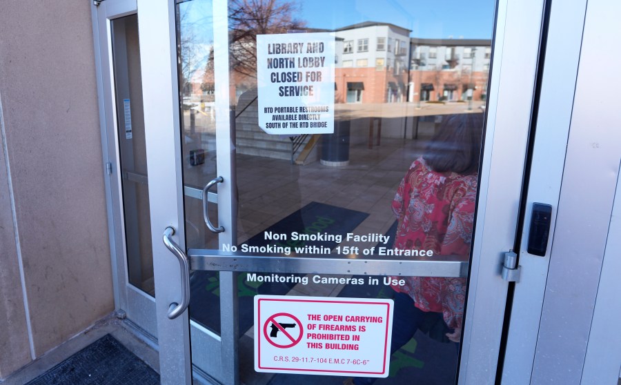 Signs are placed on the outside doors of city hall to advise visitors that the library as well as a restroom are closed because of meth contamination