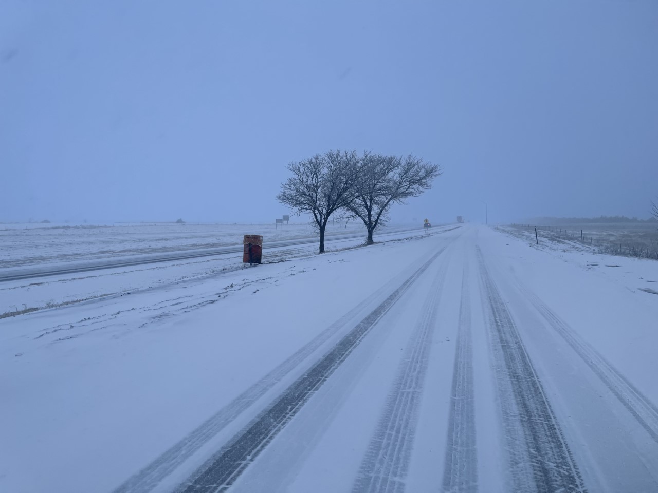 Snow-packed and icy road on the plains