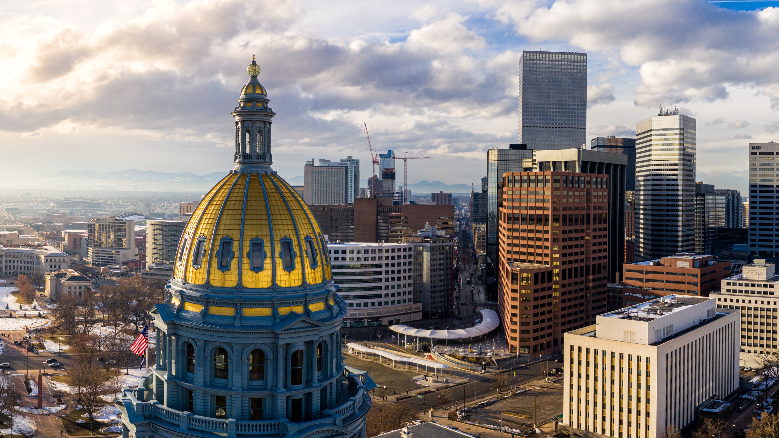 Colorado Capitol gold dome and Denver Skyline at sunset