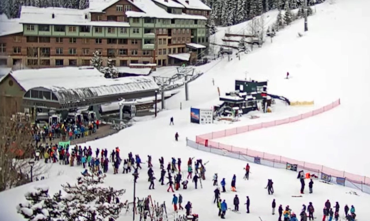 Many people wait in line for the ski lift at Winter Park Resort