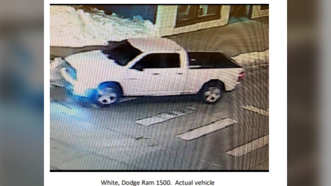 Surveillance image of a white four-door truck