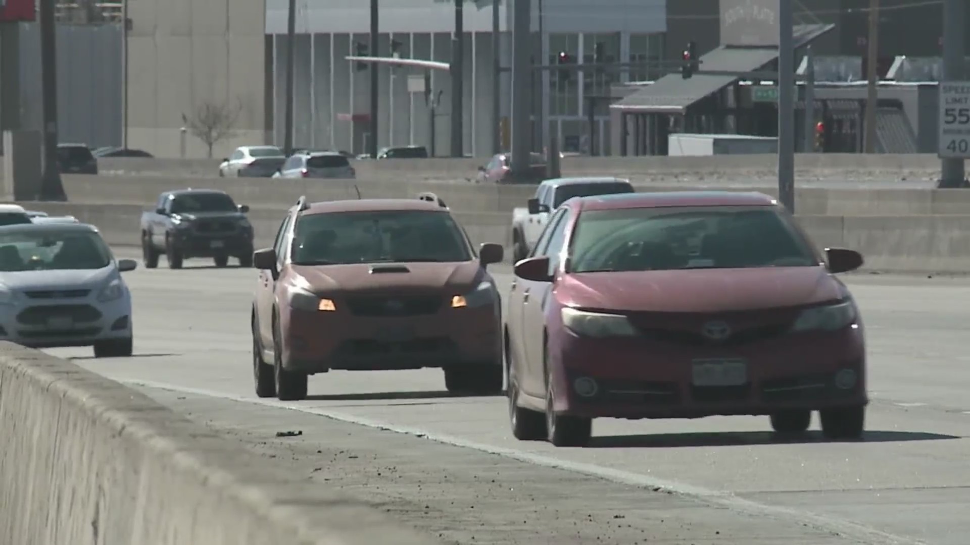 Several vehicles driving on a road in Denver