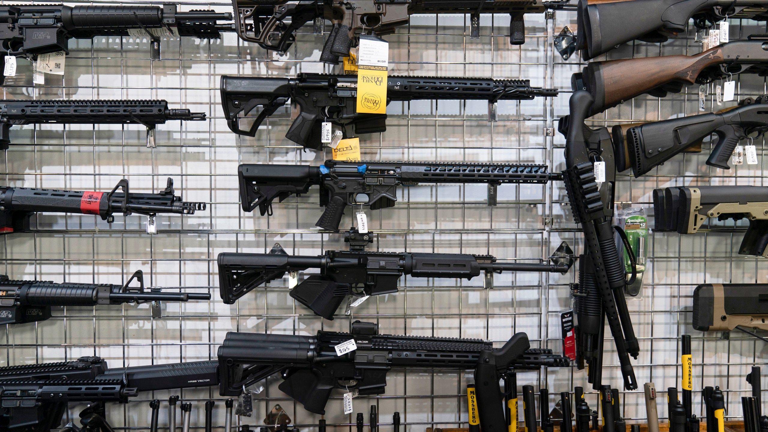 AR-15-style rifles on display on a store wall