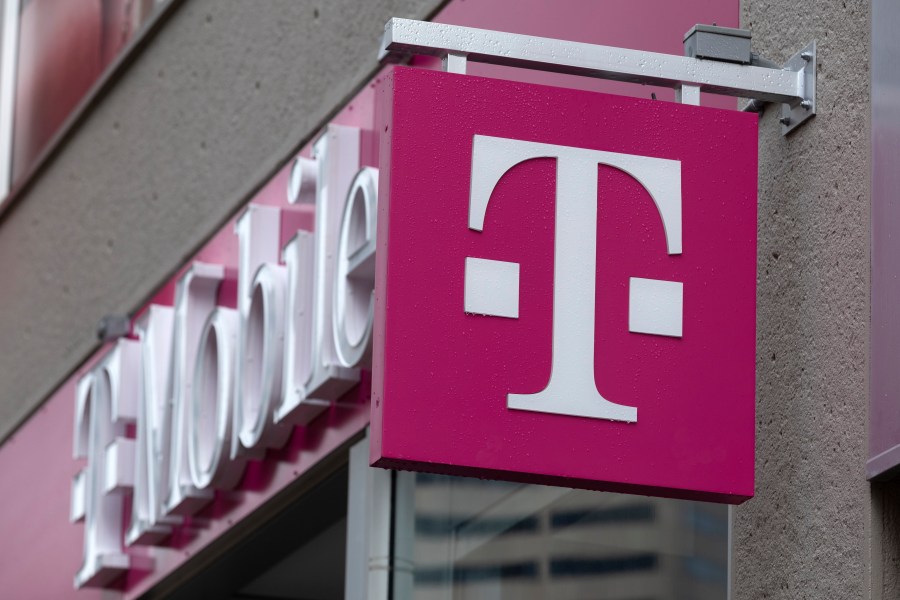 The T-Mobile logo is seen on a storefront