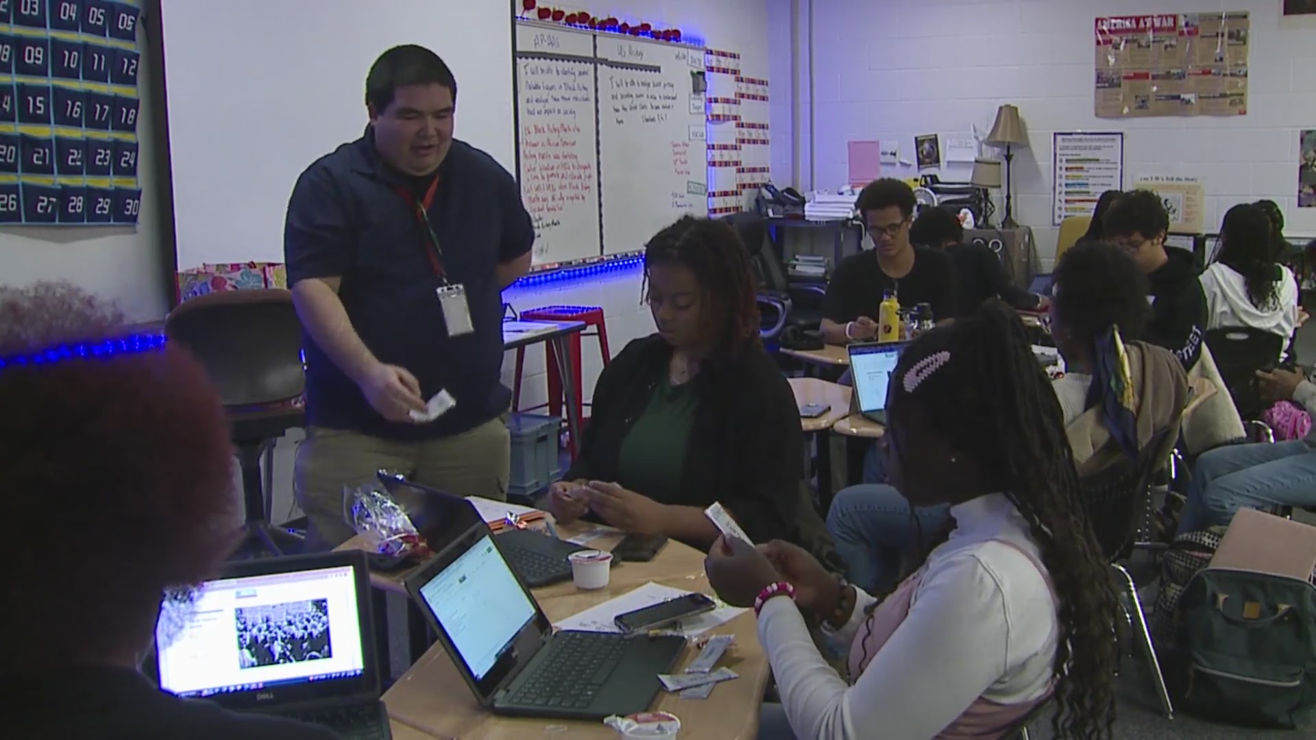 Several students sitting at tables in a classroom