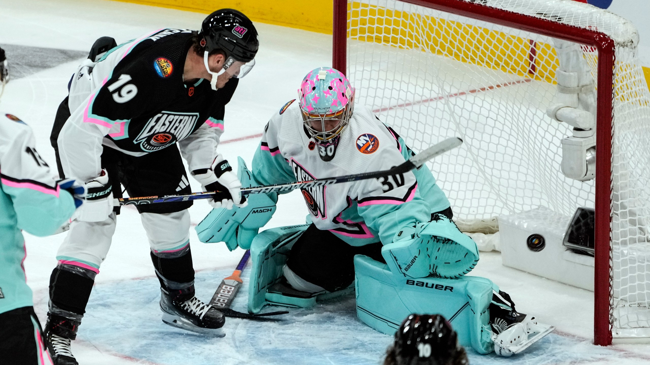 Atlantic Division's Matthew Tkachuk, of the Florida Panthers (19) scores against Metropolitan Divisions' goaltender Ilya Sorokin, of the New York Islanders (30)