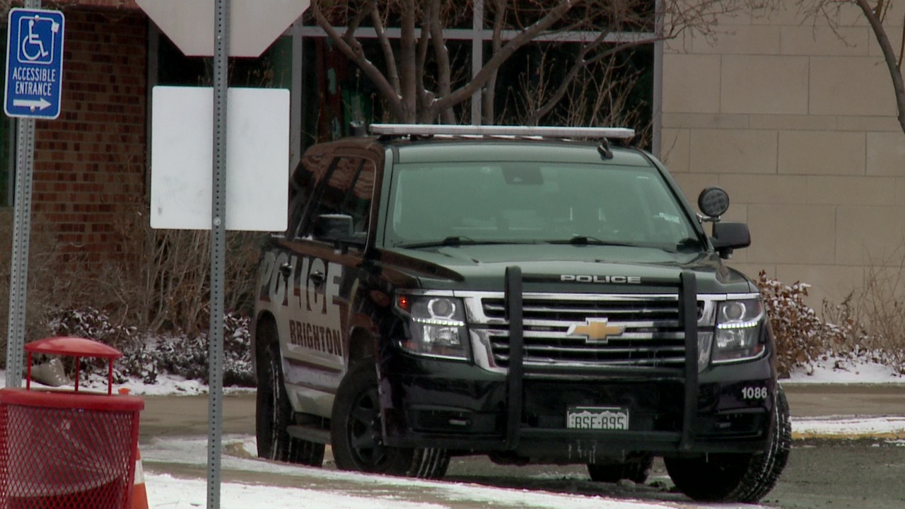 A Brighton Police vehicle outside of a Brighton school