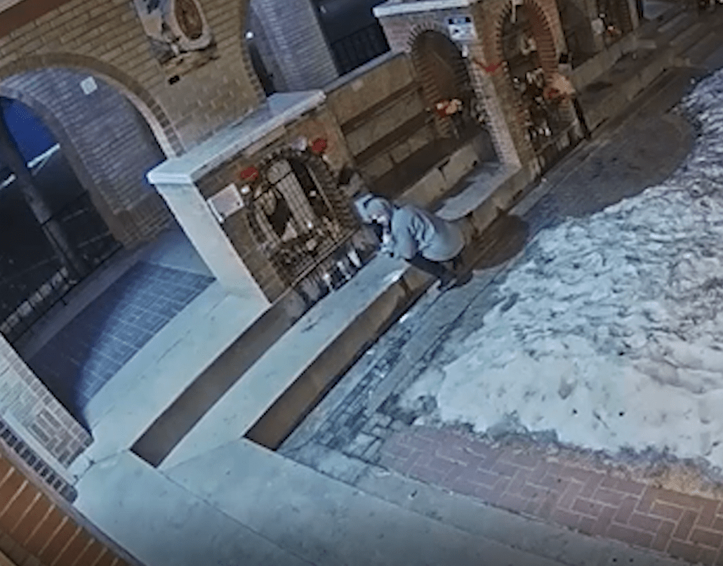 Surveillance video of a person breaking into a church donation box