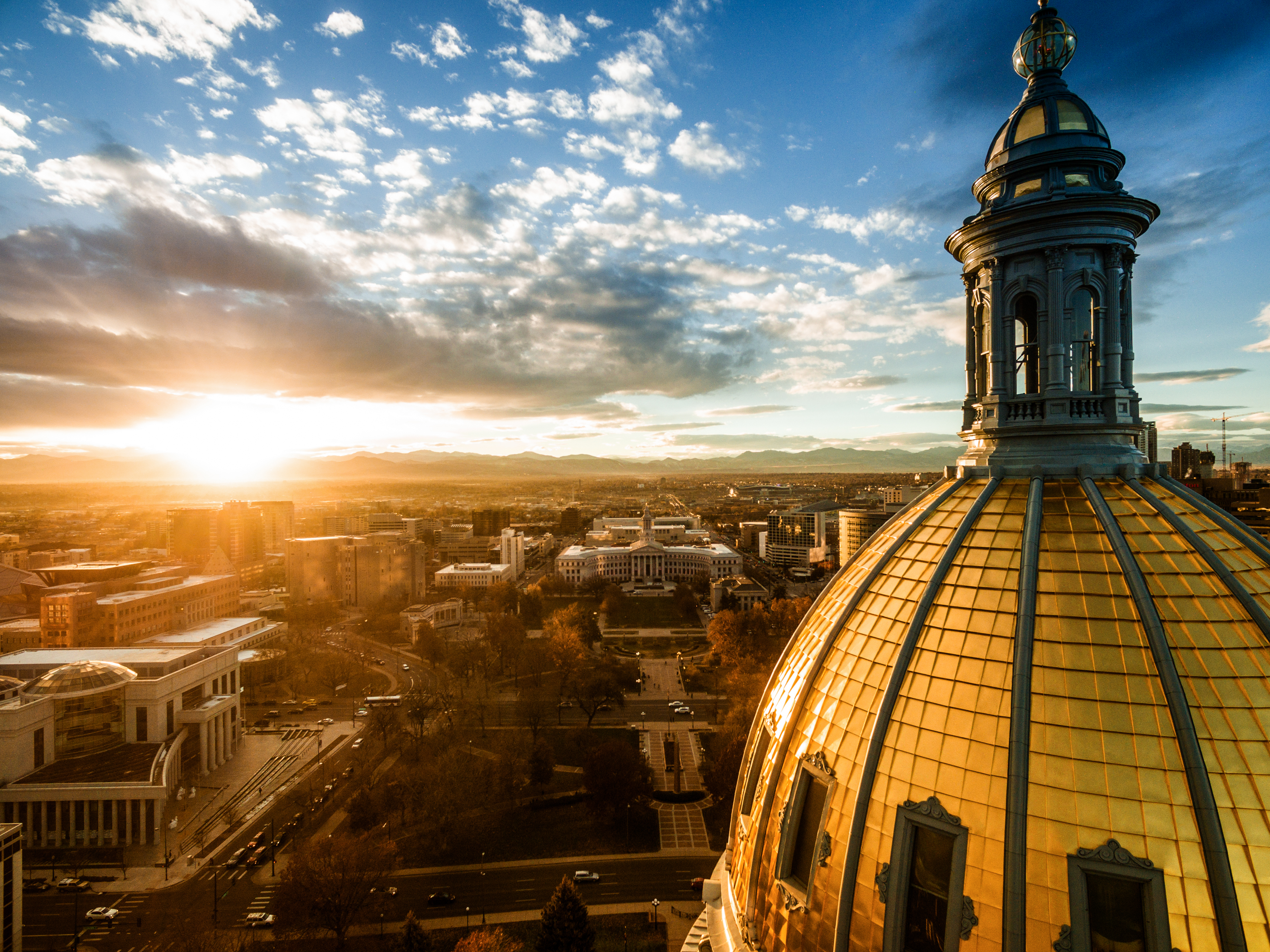 beautiful drone image of the golden cupola of the Colorado state capital building in the city of Denver