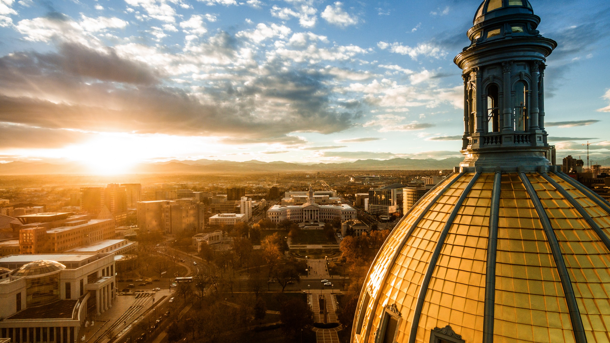 beautiful drone image of the golden cupola of the Colorado state capitol building