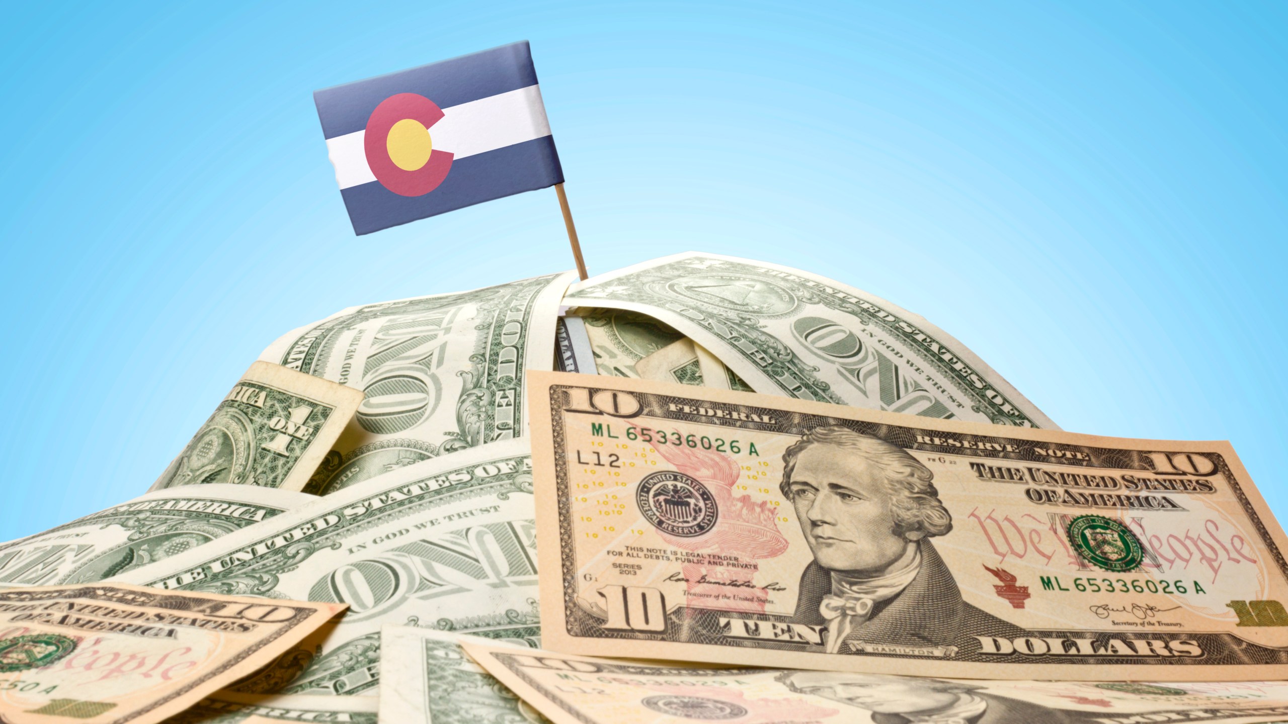 Flag of Colorado sticking in american banknotes.(series)