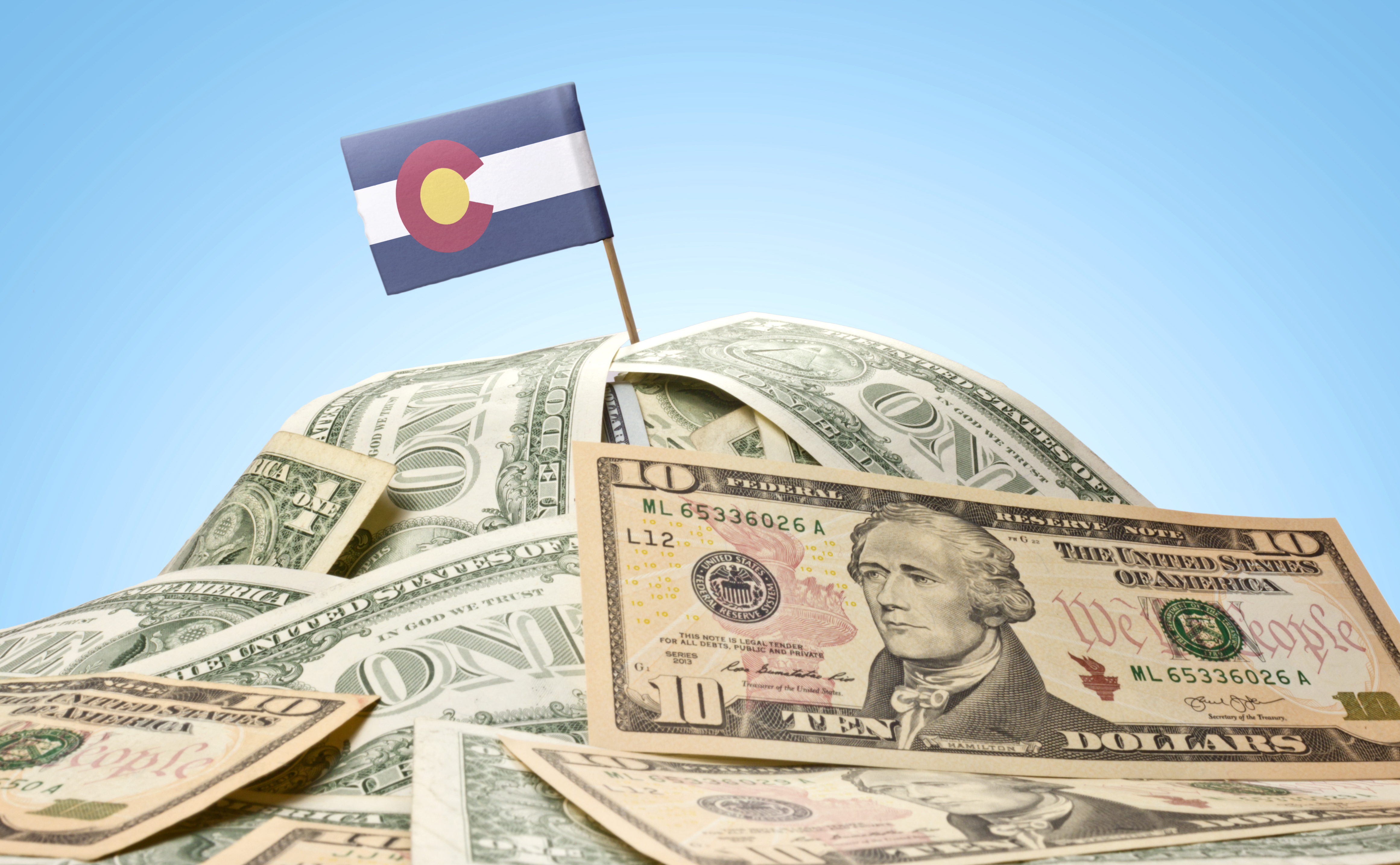 Flag of Colorado sticking in american banknotes.(series)