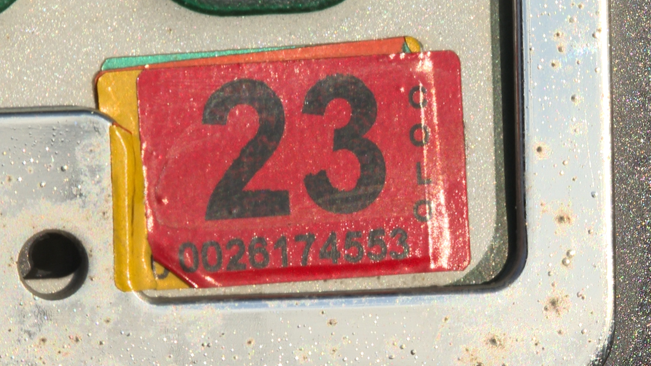 A 2023 Colorado registration sticker on the back of a license plate