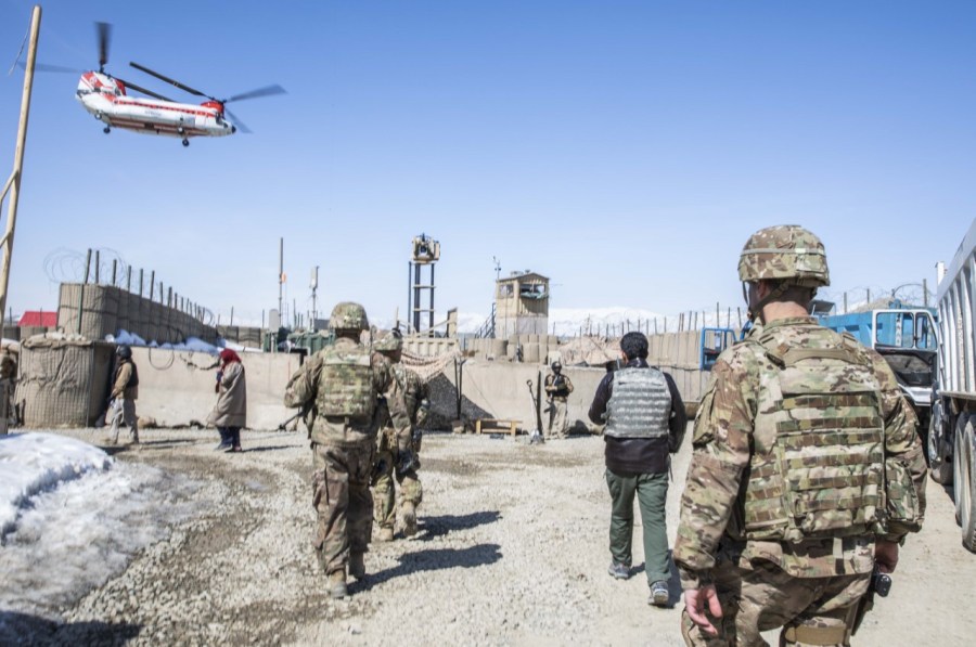 A military medical evacuation helicopter is seen in the distance