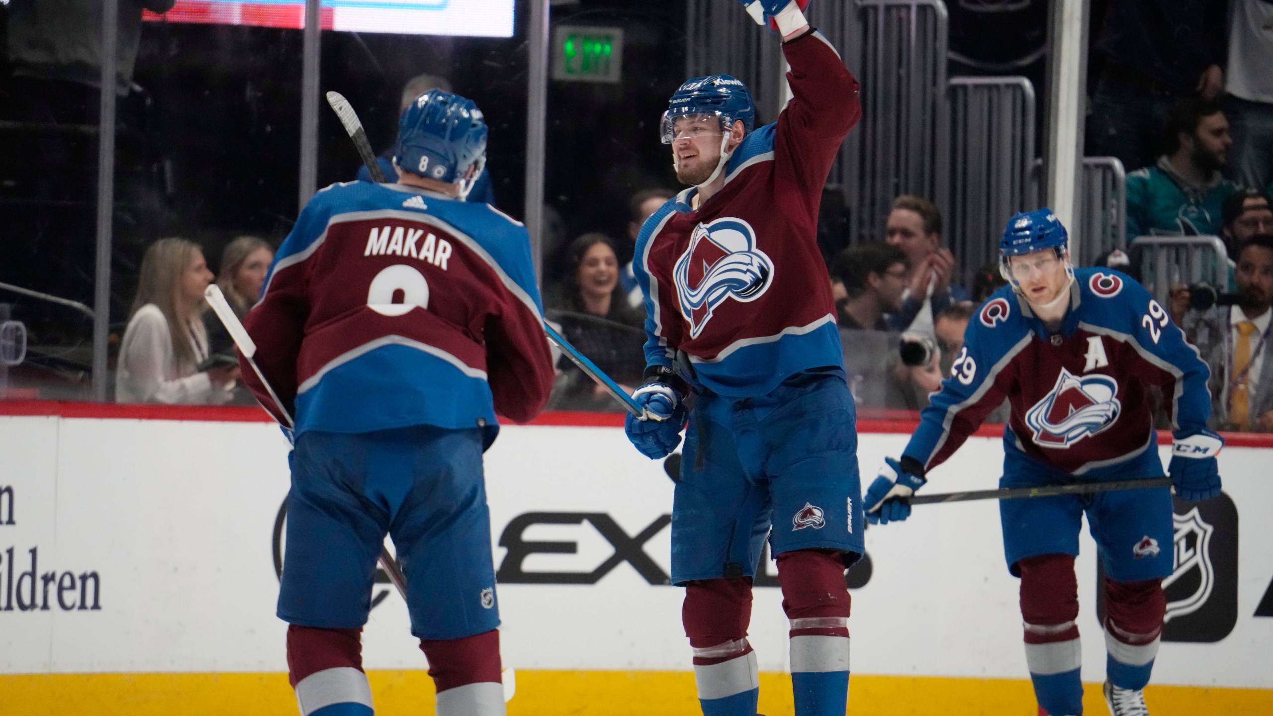 Colorado Avalanche right wing Valeri Nichushkin, center, celebrates after scoring a goal with defenseman Cale Makar, left, and center Nathan MacKinnon