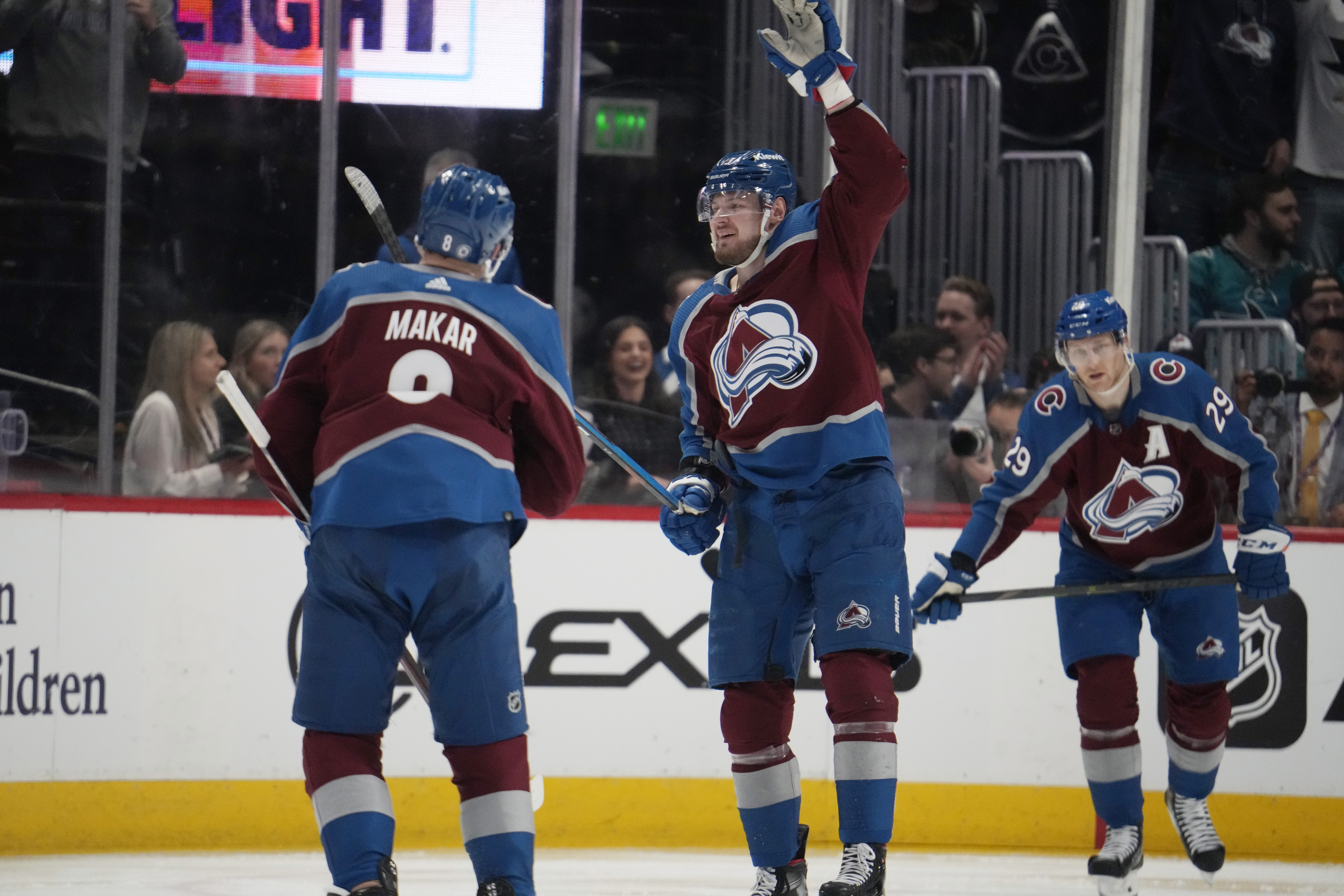 Colorado Avalanche right wing Valeri Nichushkin, center, celebrates after scoring a goal with defenseman Cale Makar, left, and center Nathan MacKinnon