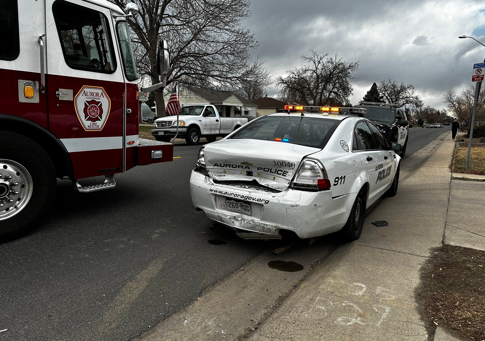 An Aurora police officer was injured after a driver rear-ended his patrol vehicle while he was sitting inside