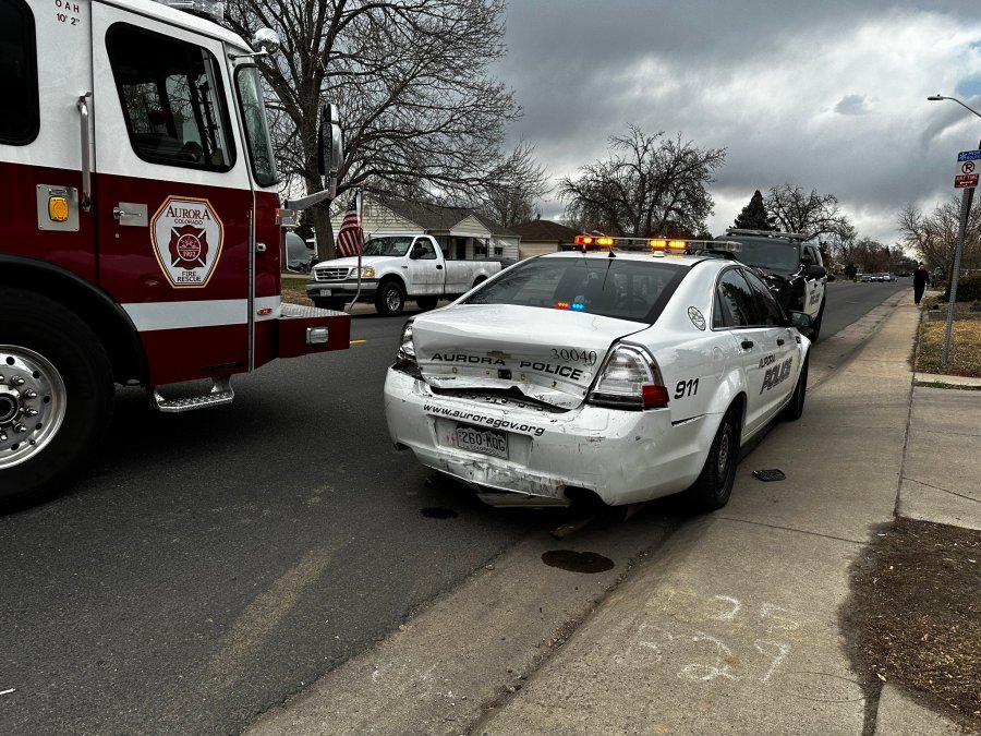 An Aurora police officer was injured after a driver rear-ended his patrol vehicle while he was sitting inside