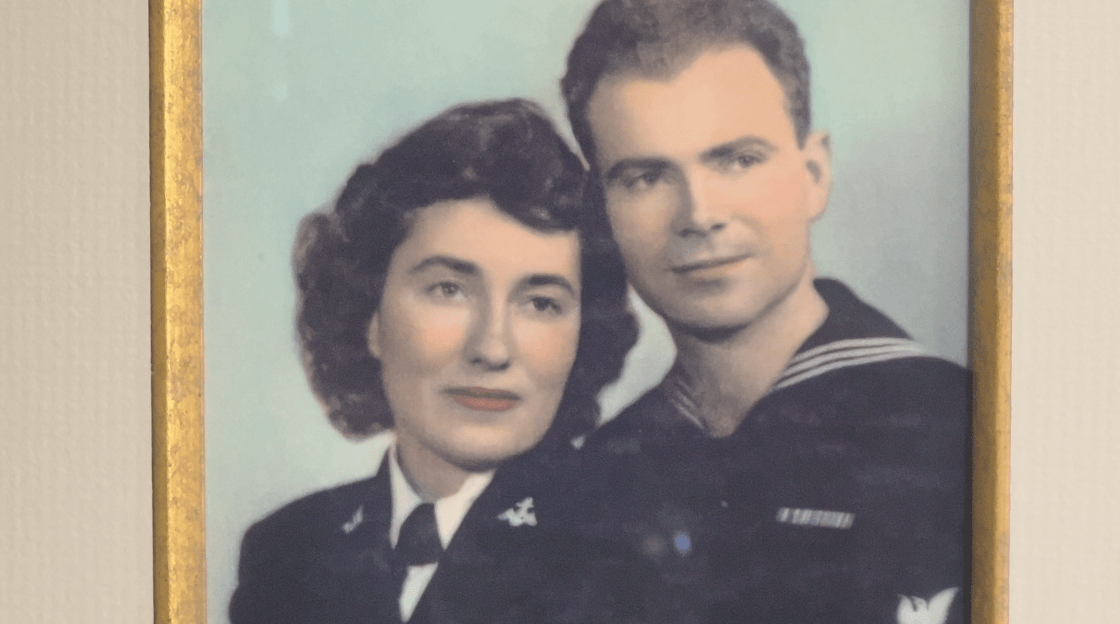 An early colored photograph of a young couple in military uniform