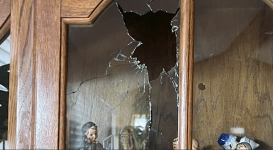 Broken glass on the door of a China cabinet