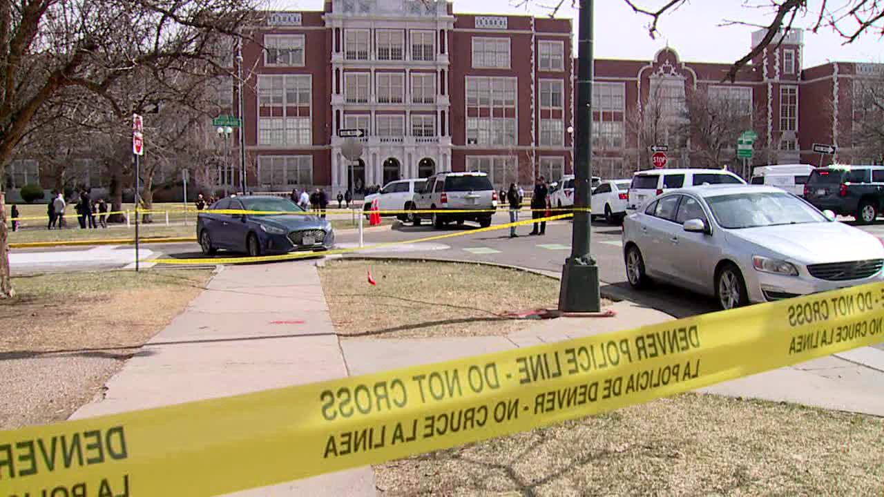 Police tape outside Denver East High School after a shooting on March 22, 2023.