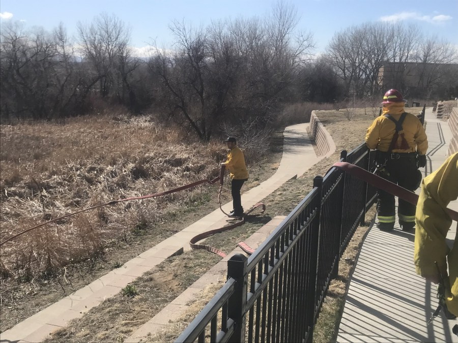 Firefighter works on blaze off Parker and Chambers roads in Aurora