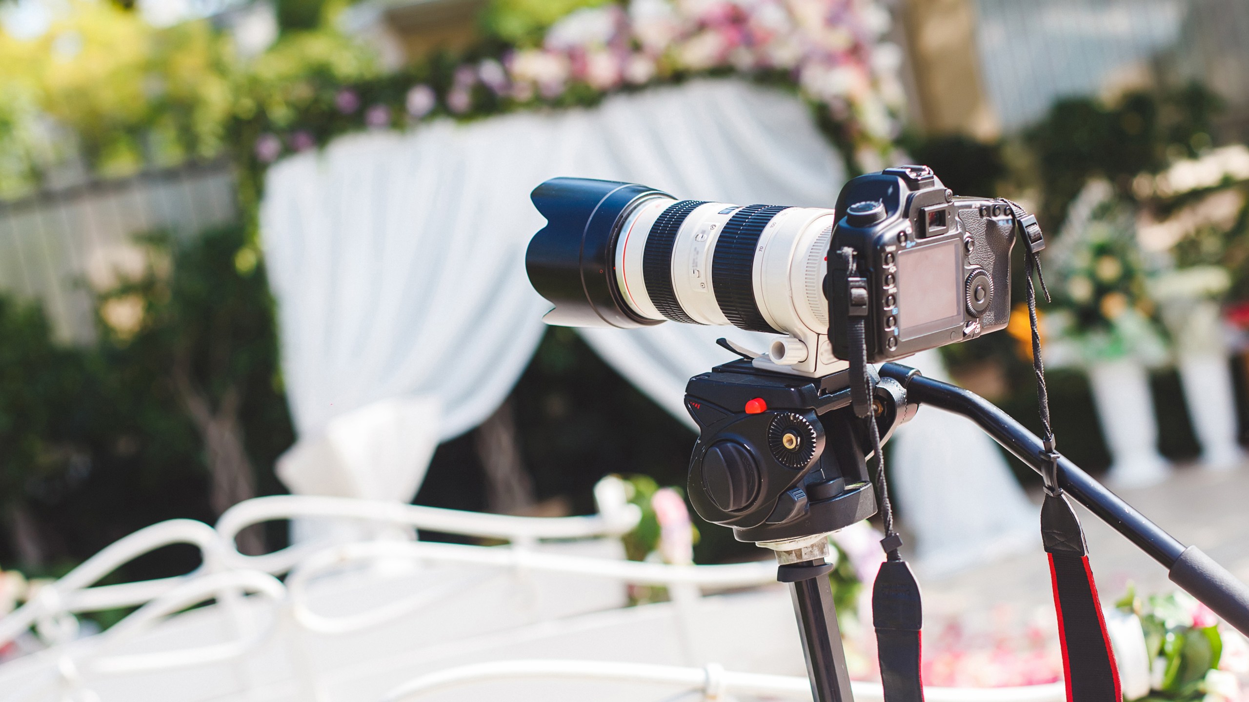 The work of photographer and videographer at the wedding. The camera and lens.