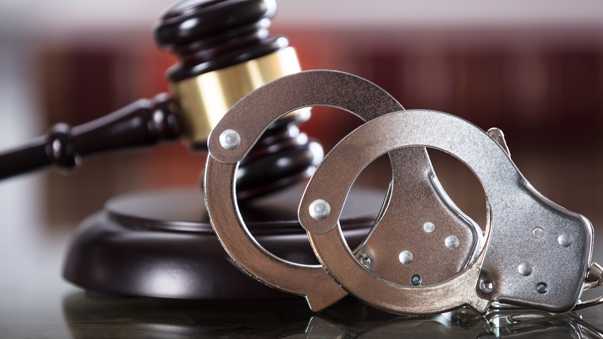 Close-up Of Handcuffs And Gavel