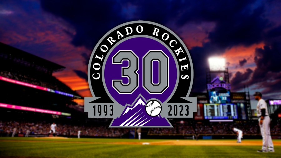 The Colorado Rockies 30th Anniversary logo is seen over a photo of a sunset at Coors Field in 2017.