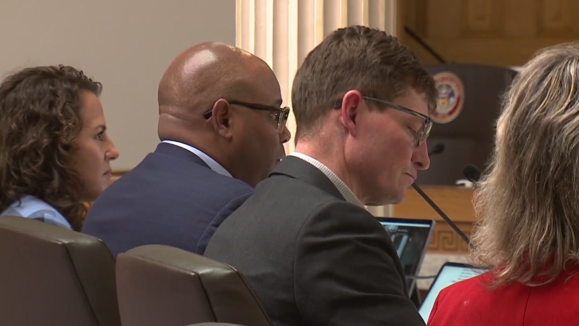 Robert Kenney and Nick Wagner sit at a legislative committee table during a hearing