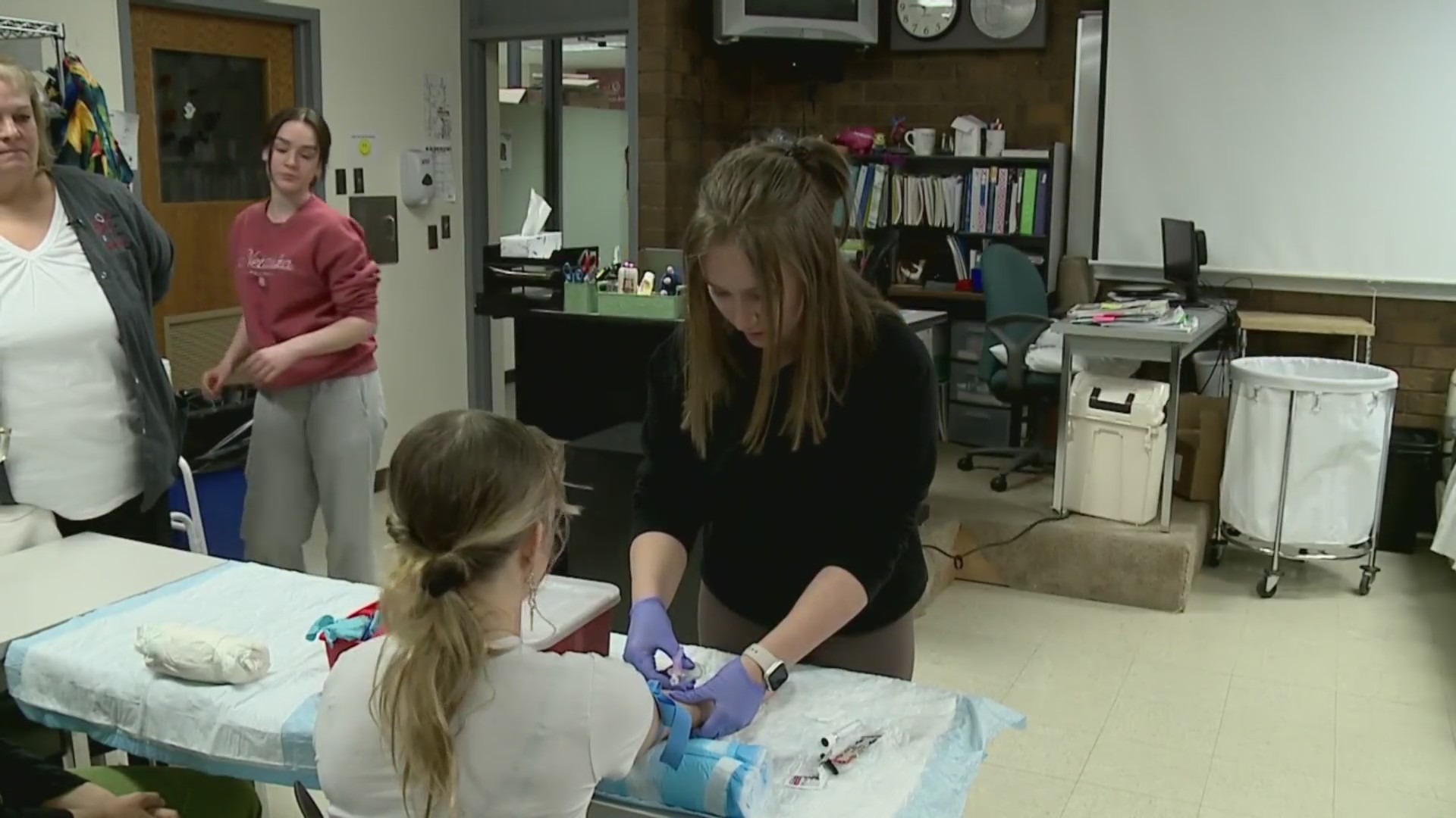 Brighton High School students learn skills to receive their Patient Care Technician certification.