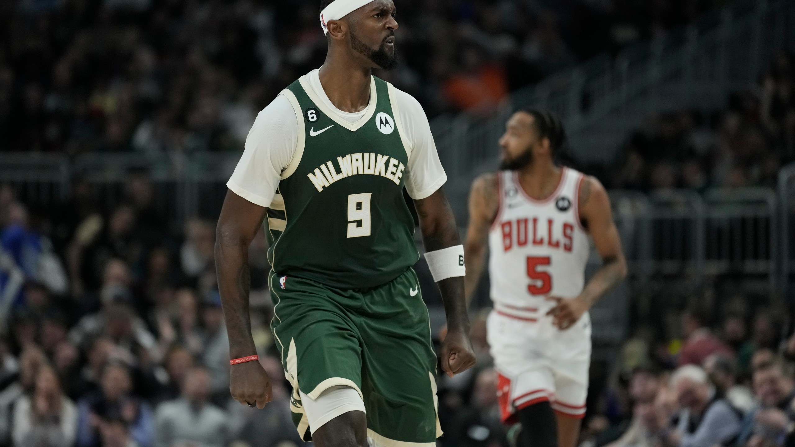 Milwaukee Bucks' Bobby Portis reacts in front opf Chicago Bulls' Derrick Jones Jr. during the second half of an NBA basketball game Wednesday, April 5, 2023, in Milwaukee. The Bucks won 105-92. (AP Photo/Morry Gash)