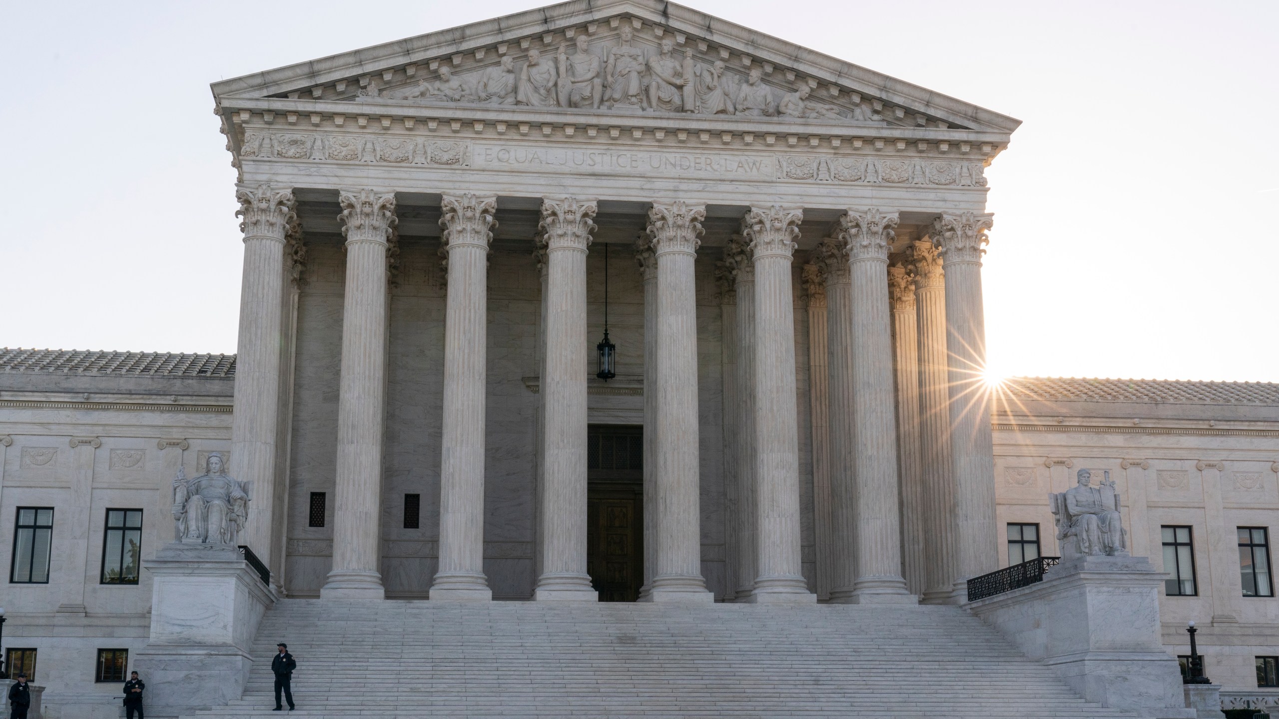 The sun rises behind the U.S. Supreme Court