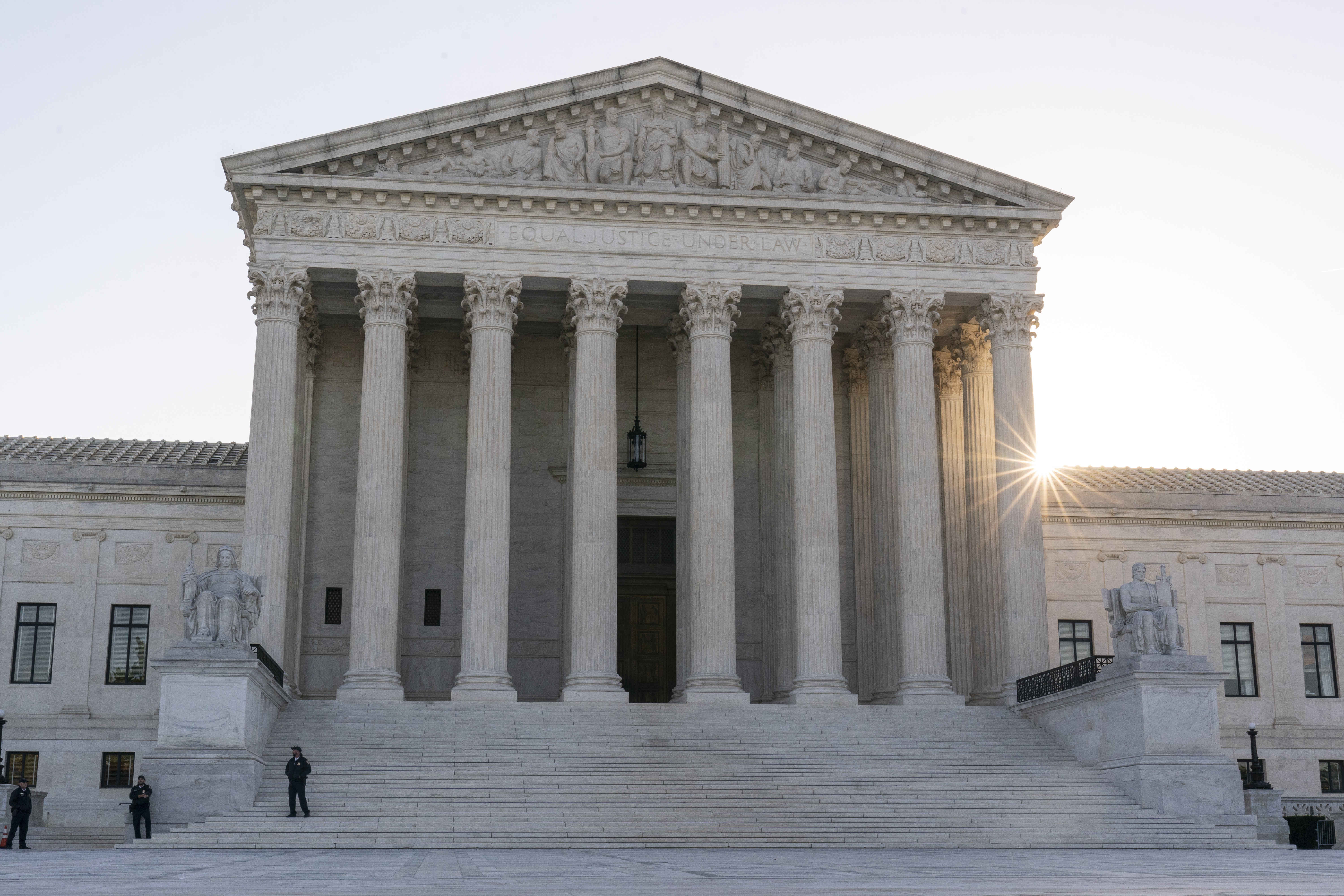 The sun rises behind the U.S. Supreme Court