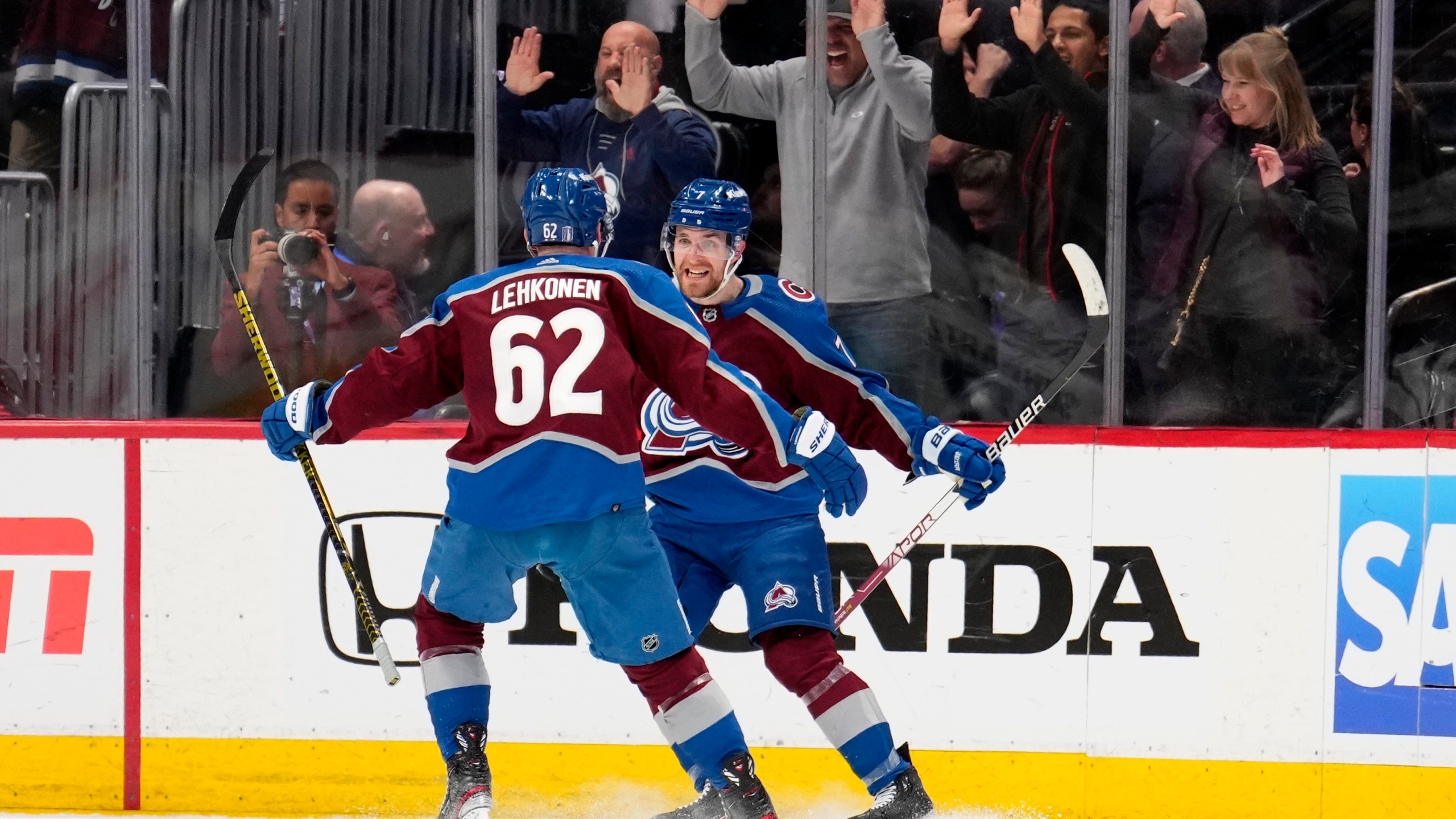 Colorado Avalanche defenseman Devon Toews (7) celebrates his goal against the Seattle Kraken with Artturi Lehkonen (62) during the third period of Game 2 of a first-round NHL hockey playoff series Thursday, April 20, 2023, in Denver. (AP Photo/Jack Dempsey)