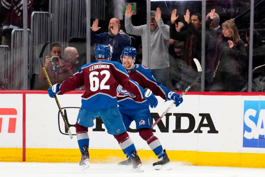 Colorado Avalanche defenseman Devon Toews (7) celebrates his goal against the Seattle Kraken with Artturi Lehkonen (62) during the third period of Game 2 of a first-round NHL hockey playoff series Thursday, April 20, 2023, in Denver. (AP Photo/Jack Dempsey)