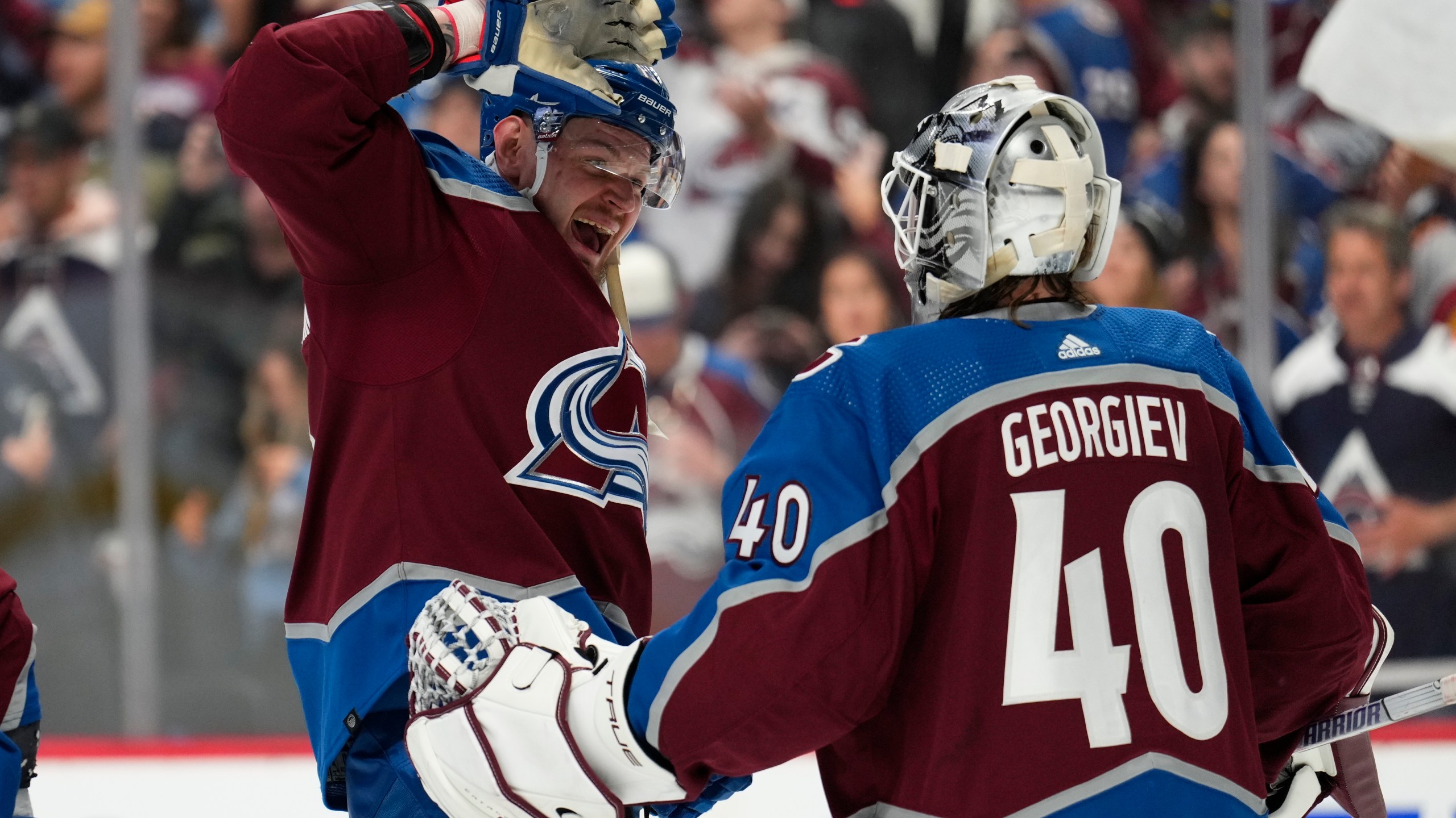 Colorado Avalanche right wing Valeri Nichushkin (13) and goaltender Alexandar Georgiev celebrate the team's 3-2 win against the Seattle Kraken in Game 2 of a first-round NHL hockey playoff series Thursday, April 20, 2023, in Denver. (AP Photo/Jack Dempsey)