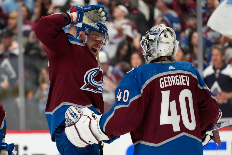 Colorado Avalanche right wing Valeri Nichushkin (13) and goaltender Alexandar Georgiev celebrate the team's 3-2 win against the Seattle Kraken in Game 2 of a first-round NHL hockey playoff series Thursday, April 20, 2023, in Denver. (AP Photo/Jack Dempsey)