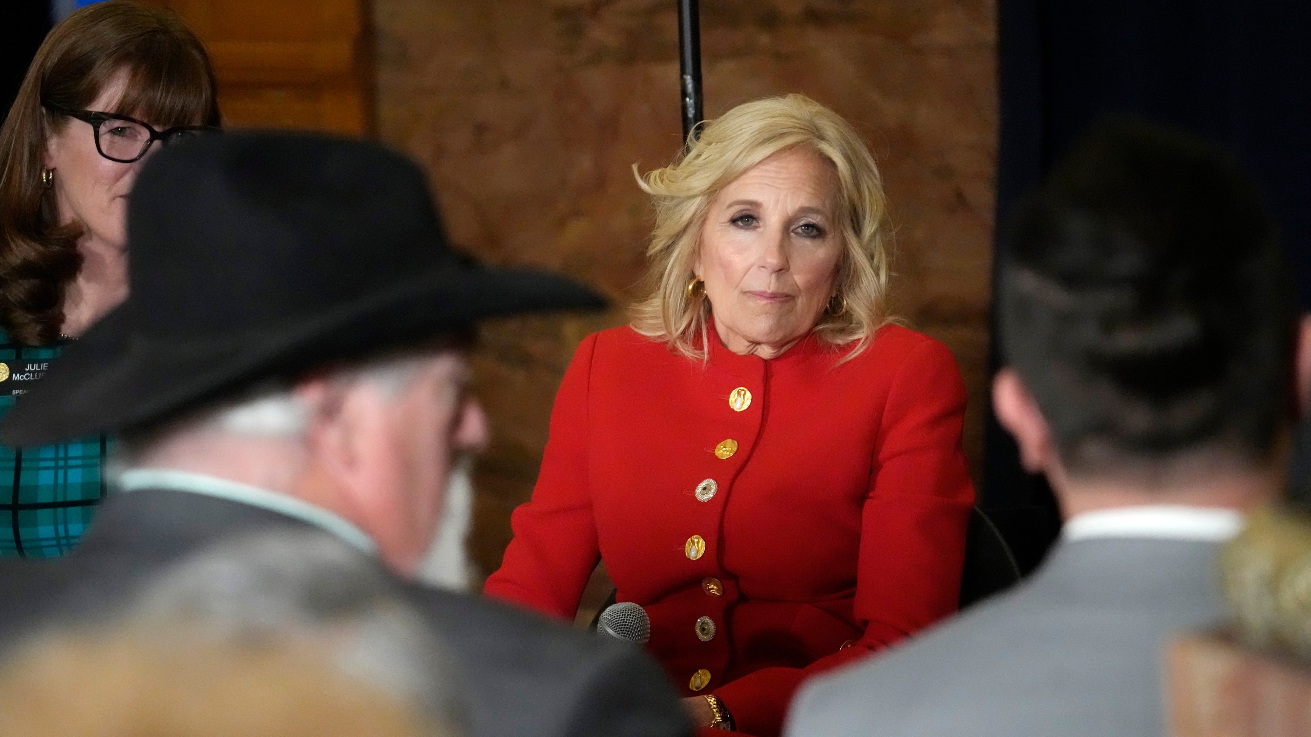 First lady Jill Biden, center, listens to lawmakers