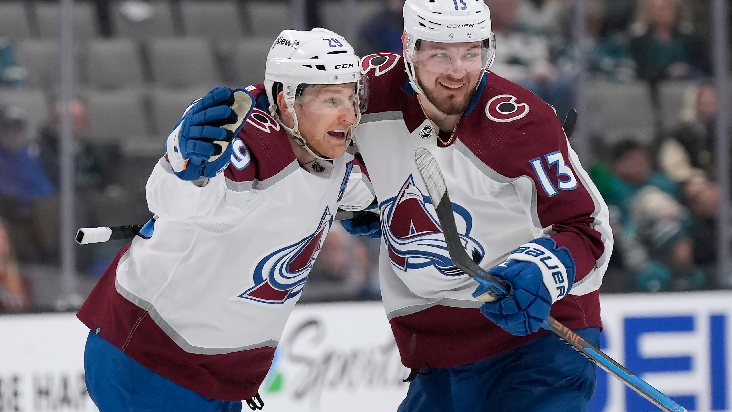 Colorado Avalanche center Nathan MacKinnon (29) celebrates with Valeri Nichushkin (13)