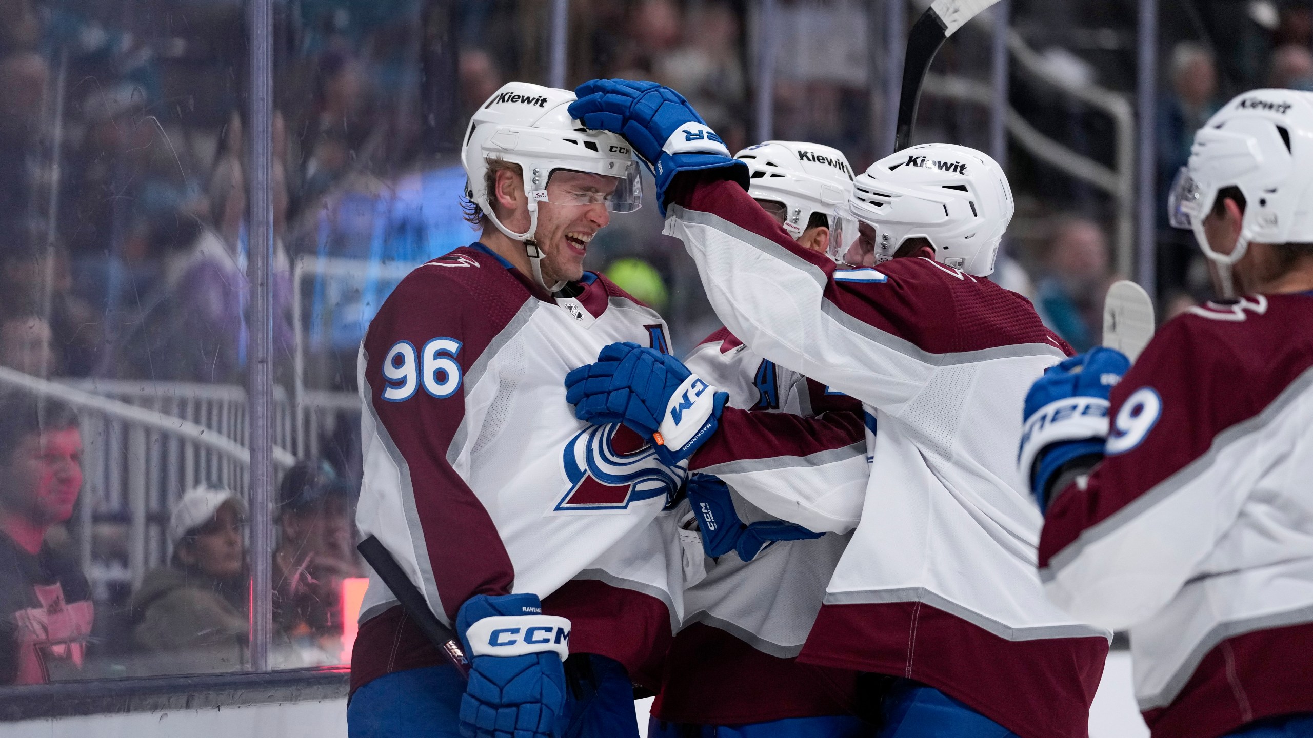 Colorado Avalanche right wing Mikko Rantanen, left, celebrates with teammates after scoring a goal