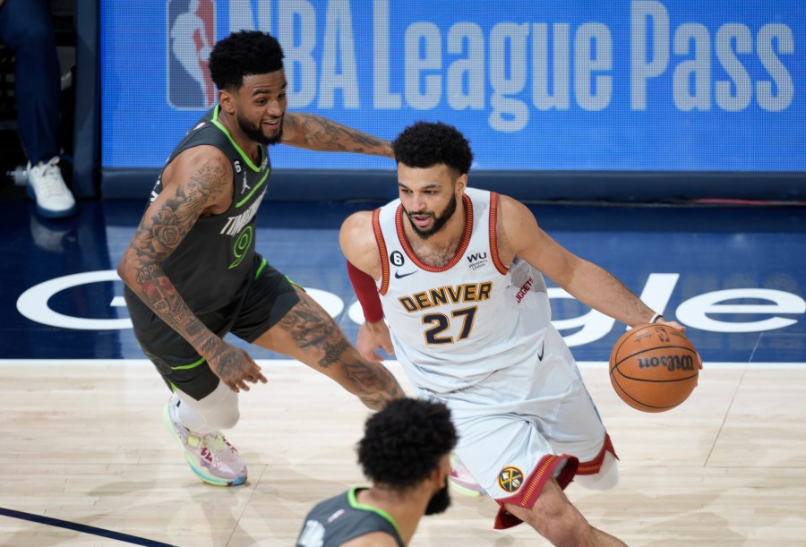 Denver Nuggets guard Jamal Murray drives past Minnesota Timberwolves guard Nickeil Alexander-Walker