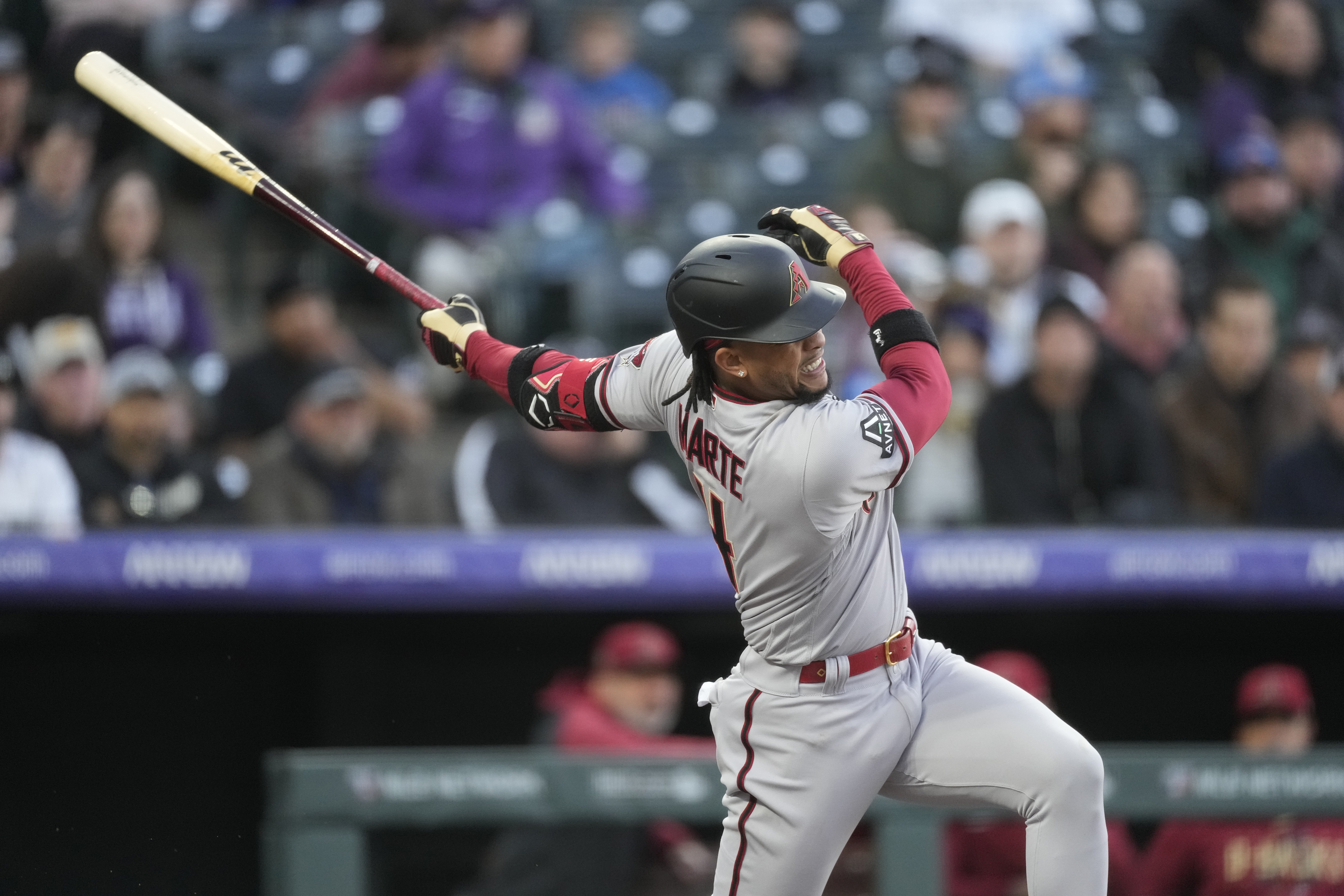 Arizona Diamondbacks' Ketel Marte watches his solo home run off Colorado Rockies starting pitcher Kyle Freeland