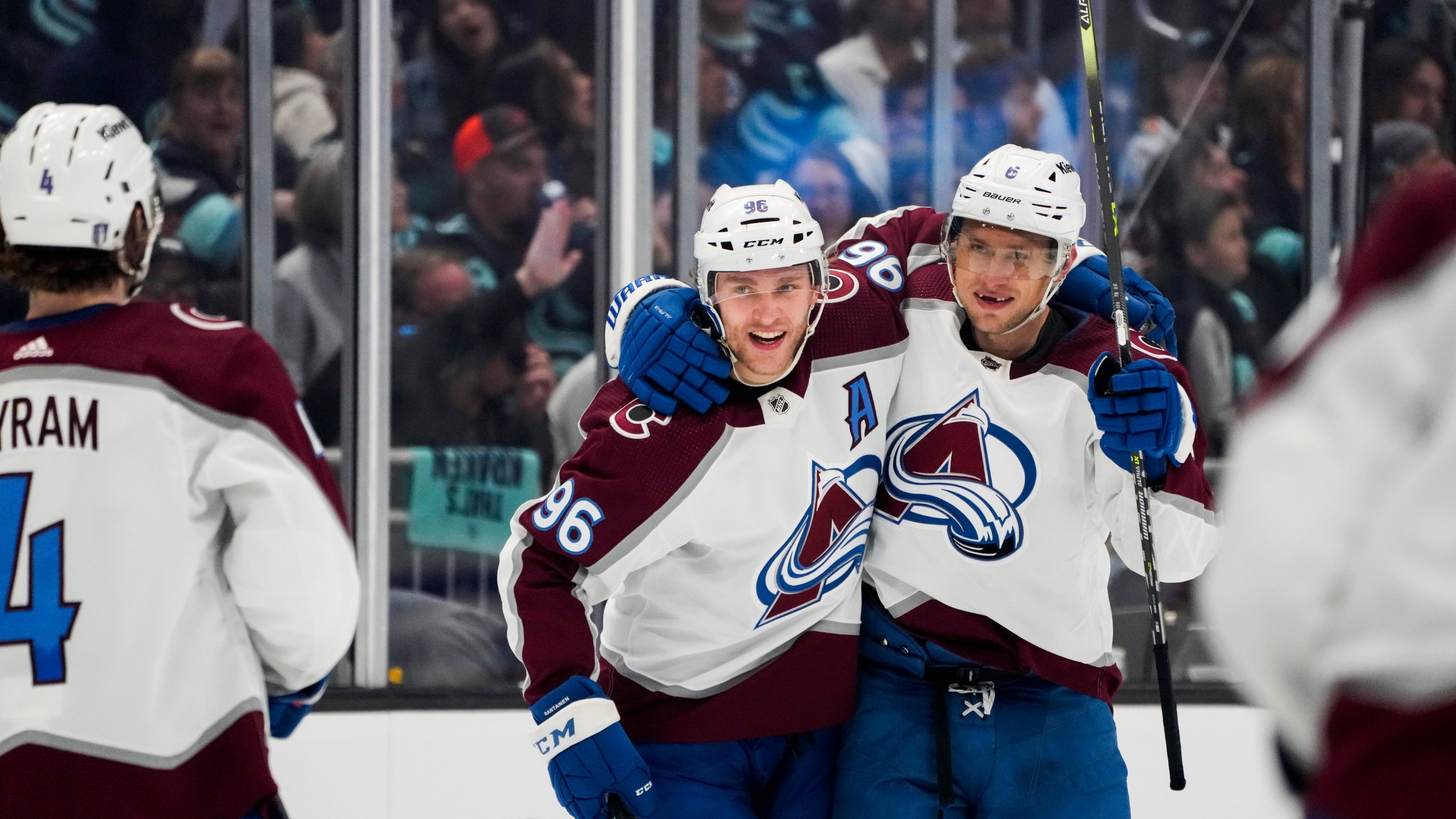 Colorado Avalanche defenseman Erik Johnson (6) celebrates his goal against the Seattle Kraken with Mikko Rantanen (96) and Bowen Byram (4)