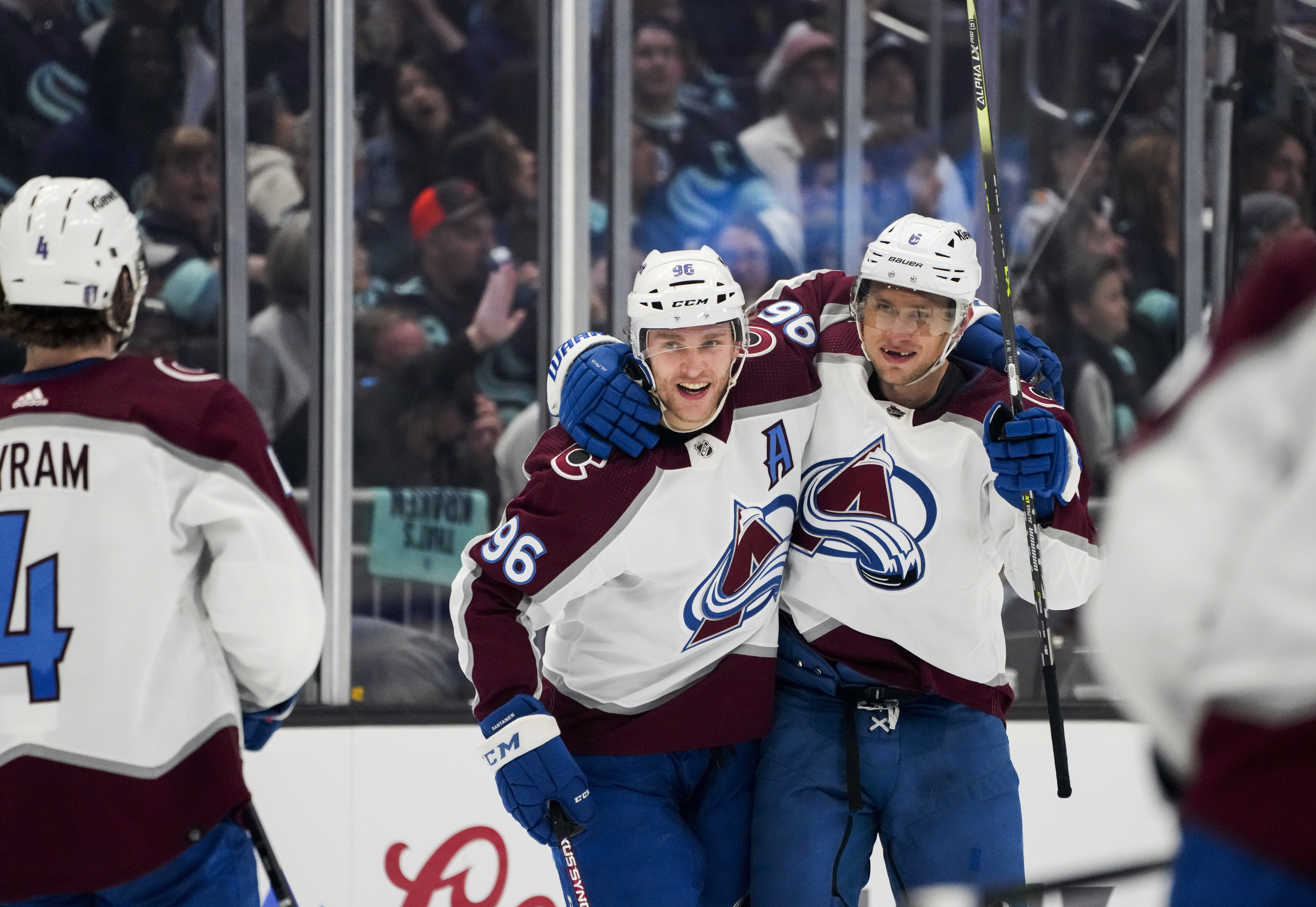 Colorado Avalanche defenseman Erik Johnson (6) celebrates his goal against the Seattle Kraken with Mikko Rantanen (96) and Bowen Byram (4)