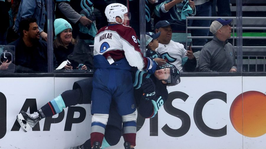 Cale Makar #8 of the Colorado Avalanche checks Jared McCann #19 of the Seattle Kraken during the first period in Game Four of the First Round of the 2023 Stanley Cup Playoffs at Climate Pledge Arena on April 24, 2023.