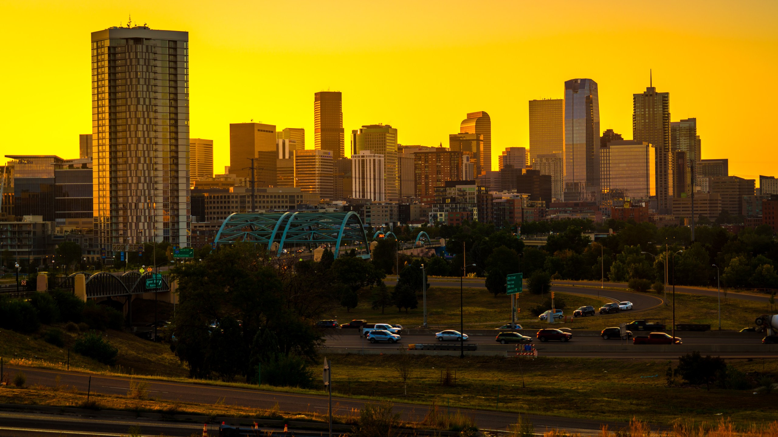 Gold sunrise colors over Denver Colorado skyline cityscape nightscape sunrise